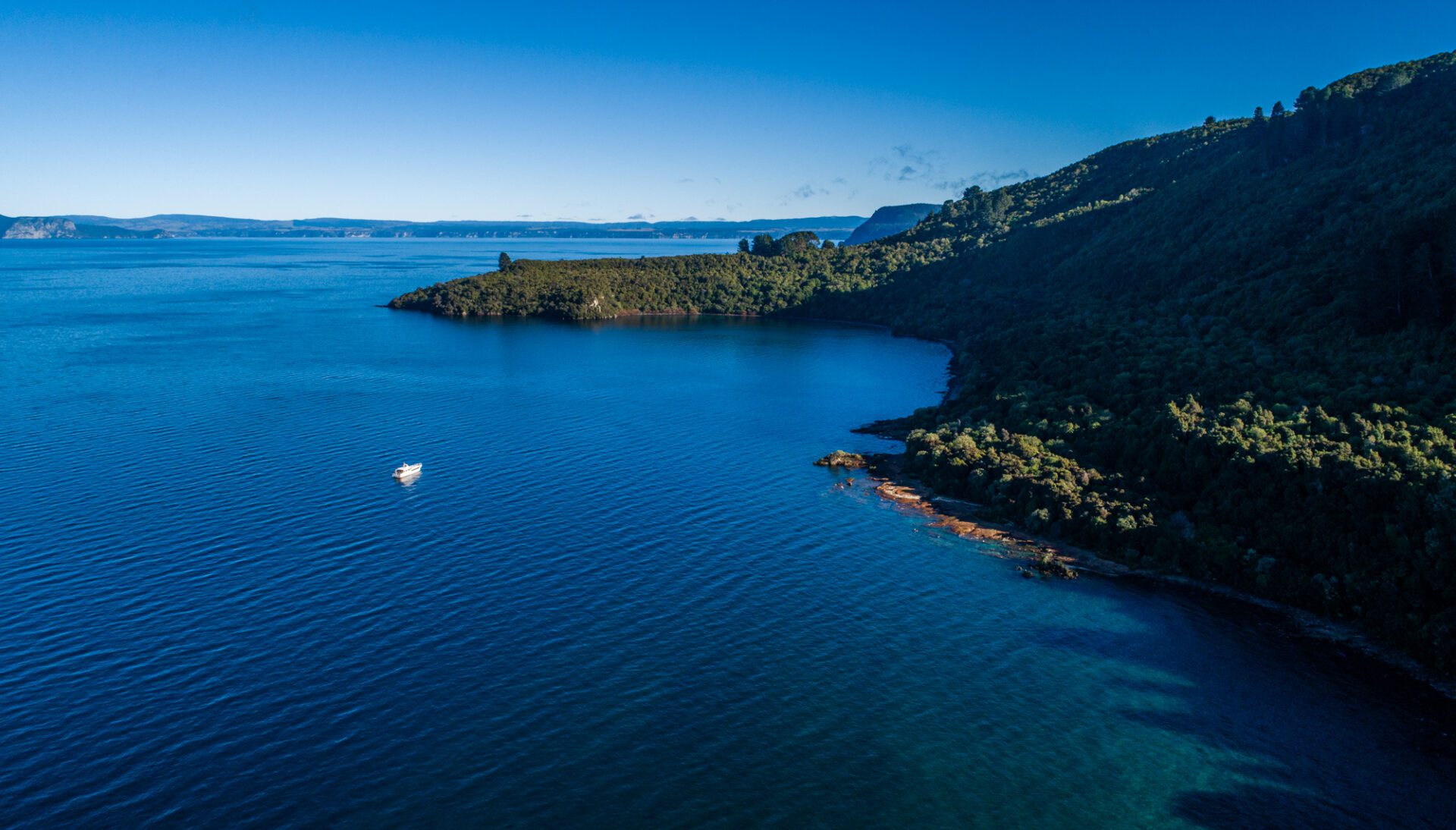 lake taupo from above and chris jolly boat