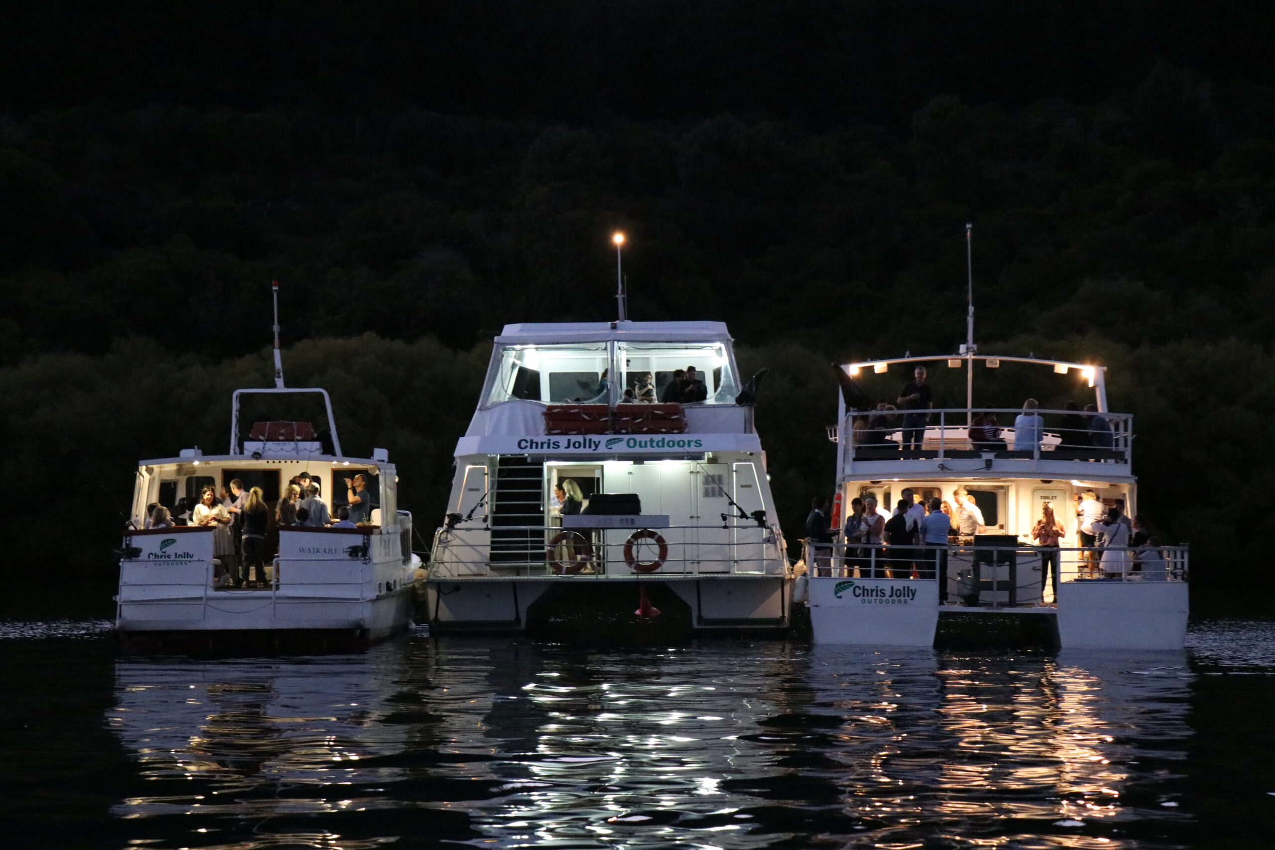 Chris jolly fleet of boats lake taupo nz night time